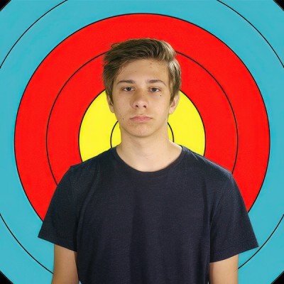 Student held in teacher murder Glum teen boy with medium brown hair in front of an archery target